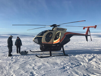 Helicopter on snow in Alaska's Seward Peninsula